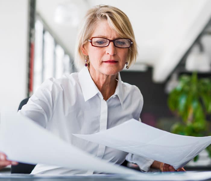 pnb-business-plan-02 Older woman organizing paperwork