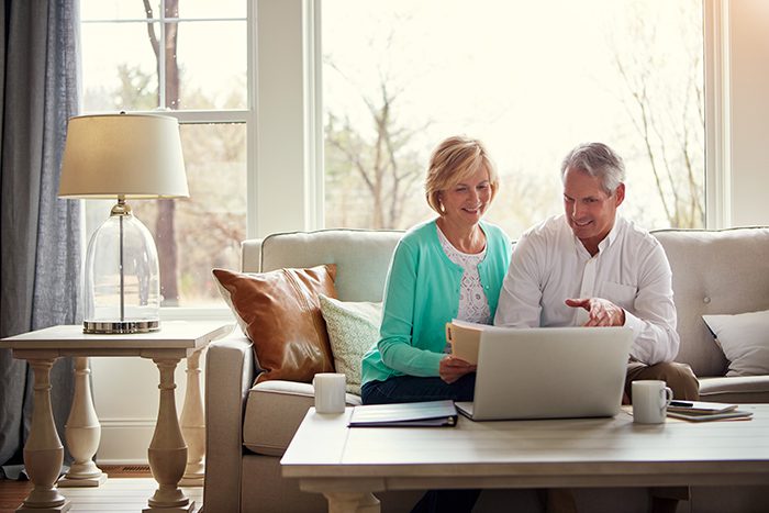 Shot of a mature couple going over their finances at home