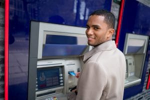 Business man making a cash withdrawal on an ATM
