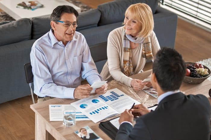 Banker discussing with senior couple