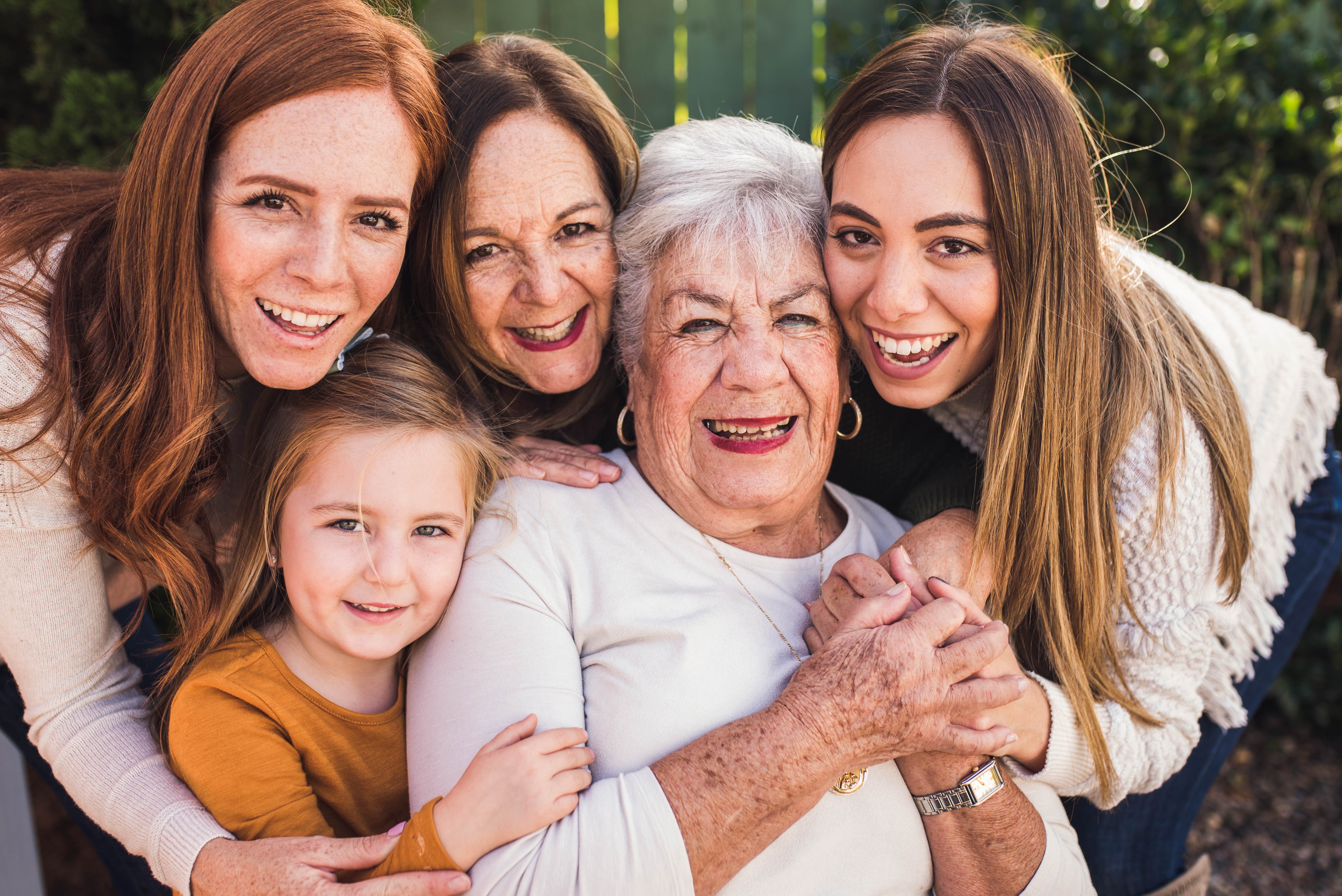 Multi-generational family of women posing together for a photo