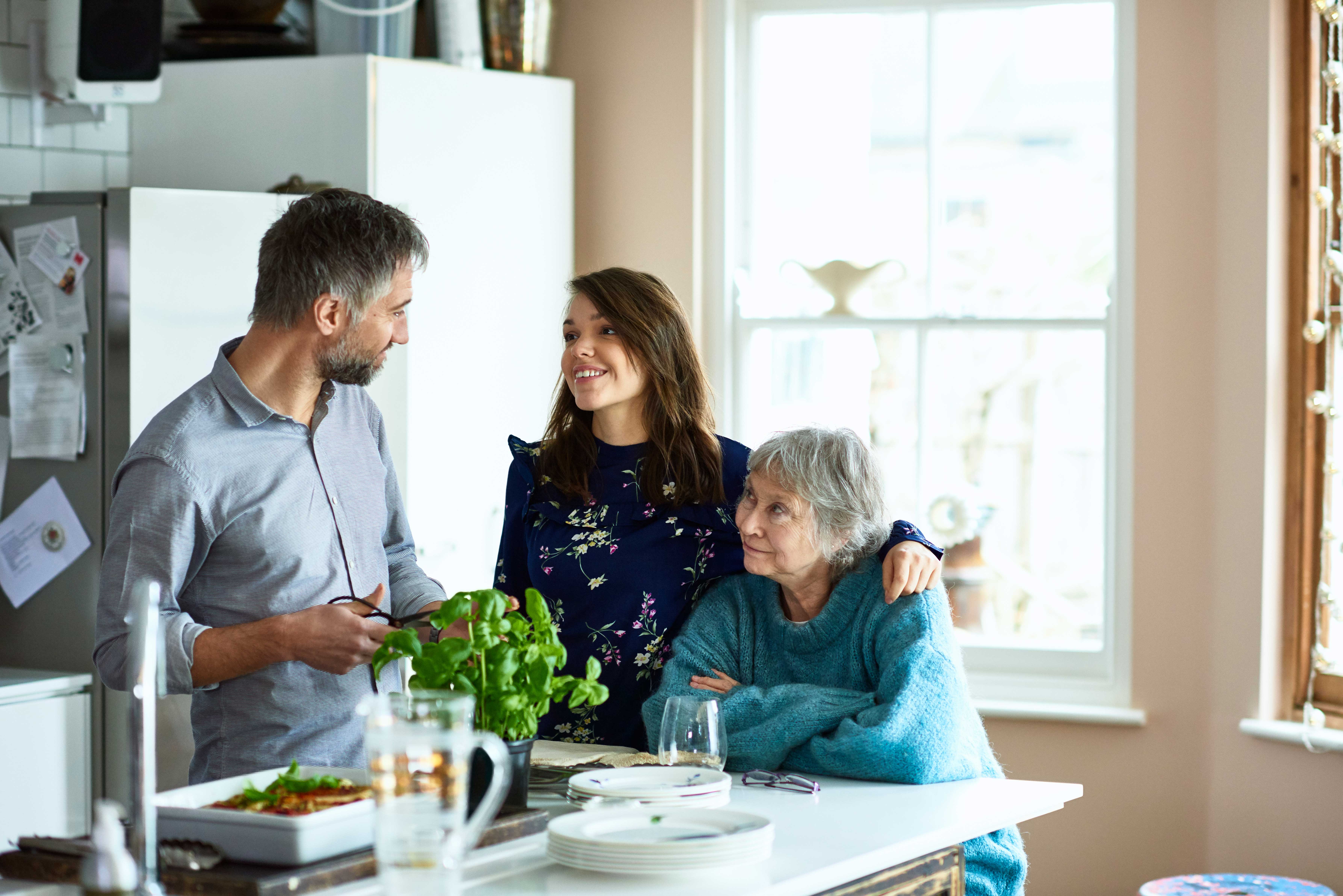 Family sitting at kitchen island